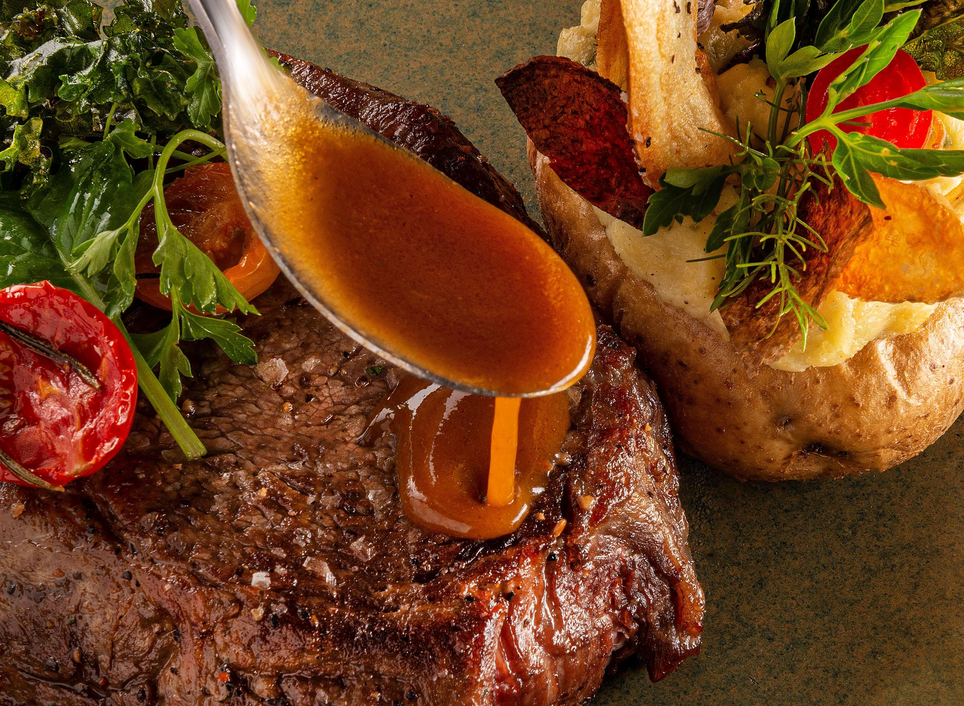 Hyatt Regency Cape Town Hotel Luaran gambar A steak being drizzled with a sauce